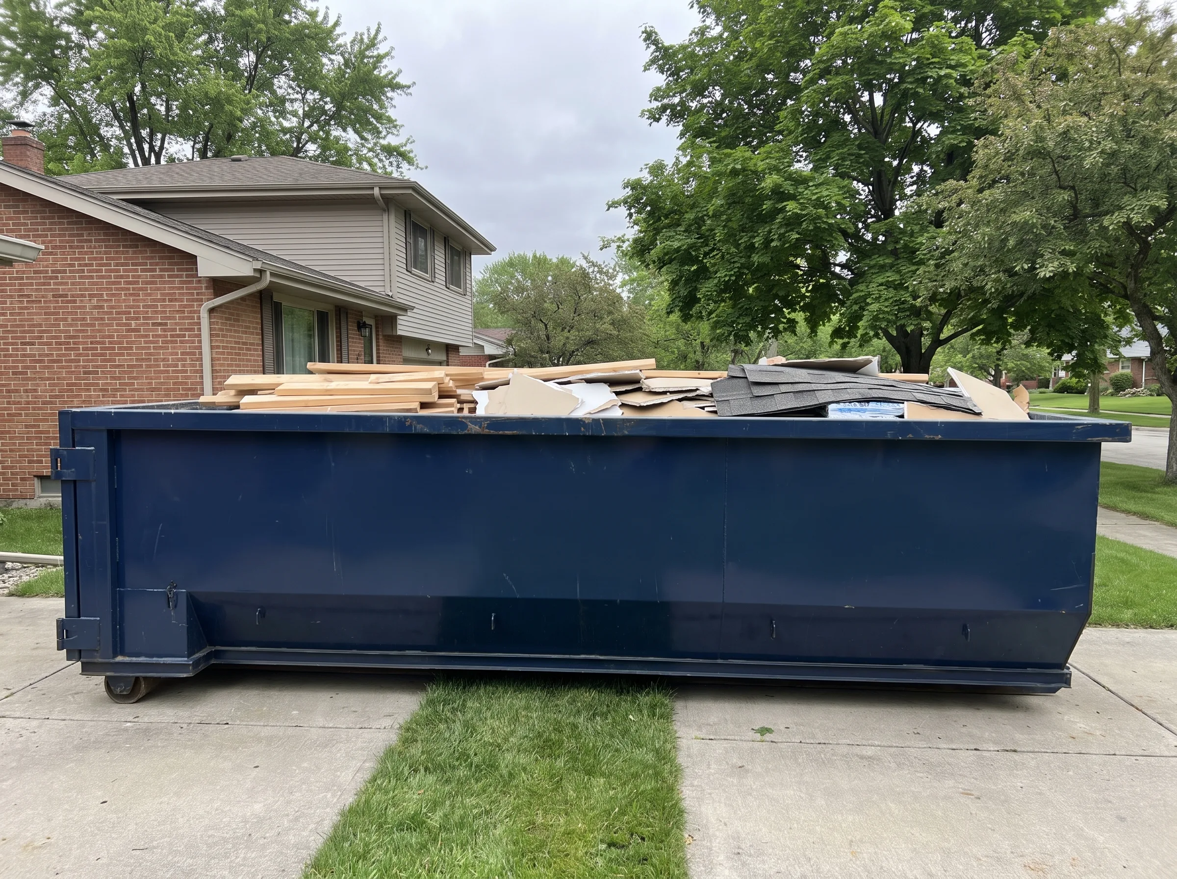 Roll-off dumpster being loaded in Adams County, WI